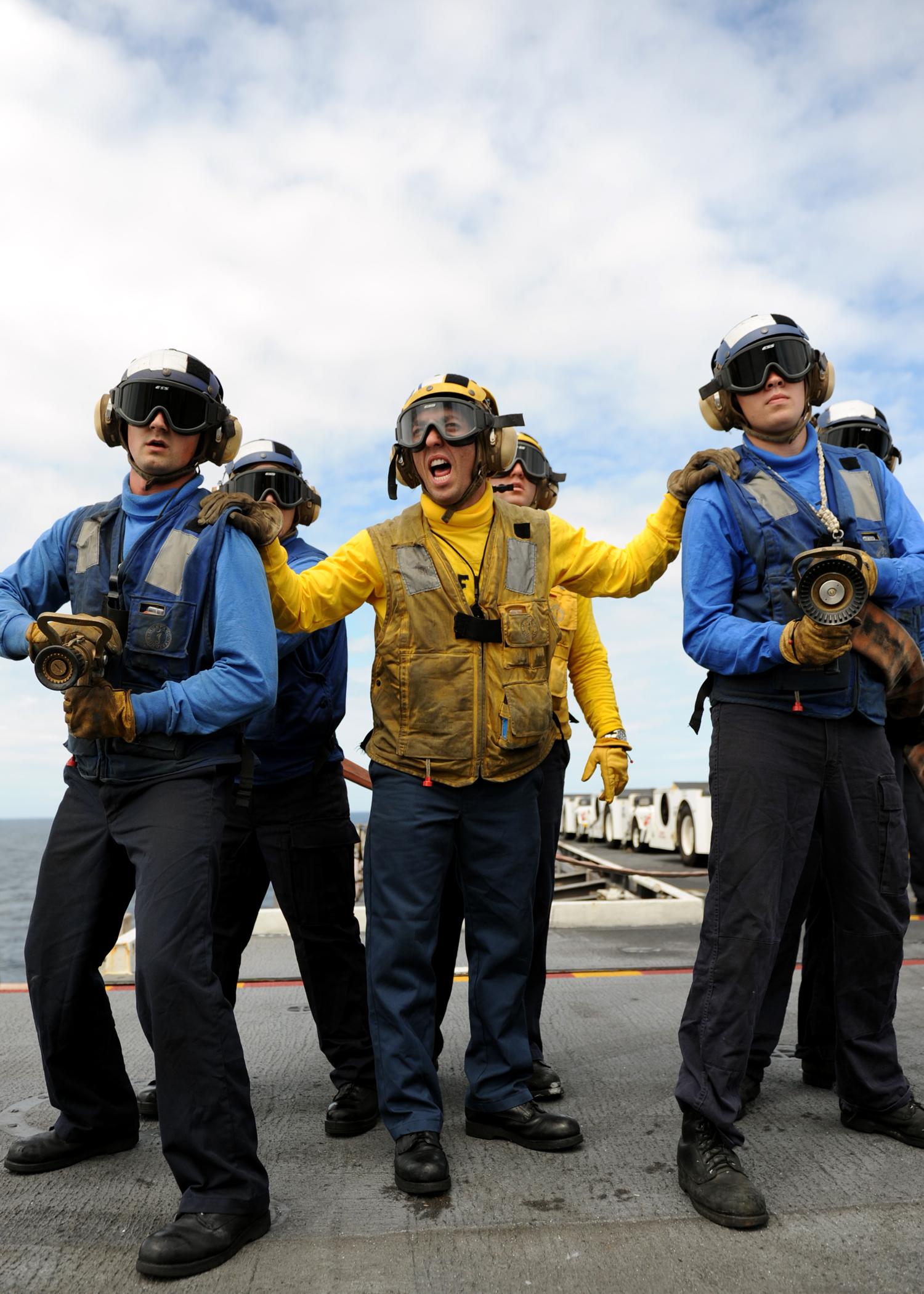 US Navy 100908-N-5386R-134 Sailors fight a simulated fire during airplane crash training aboard the aircraft carrier USS Abraham Lincoln (CVN 72)