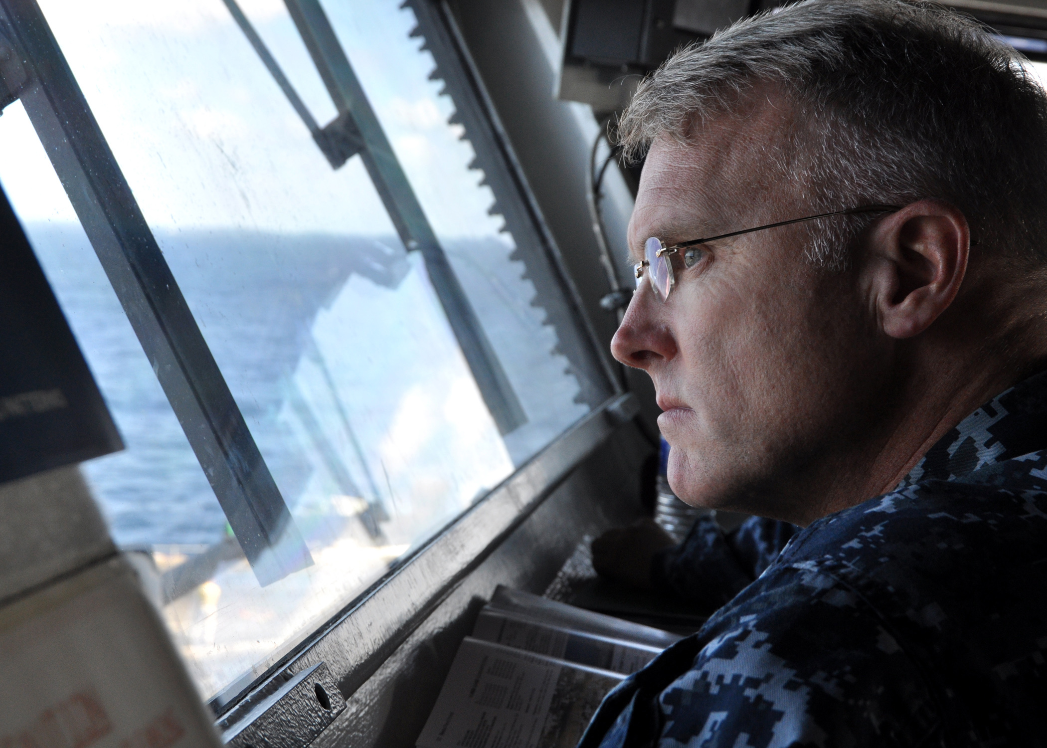 US Navy 101109-N-0981M-039 Rear Adm. Thomas Rowden, commander of Carrier Strike Group 7 oversees the vertical replenishment of supplies