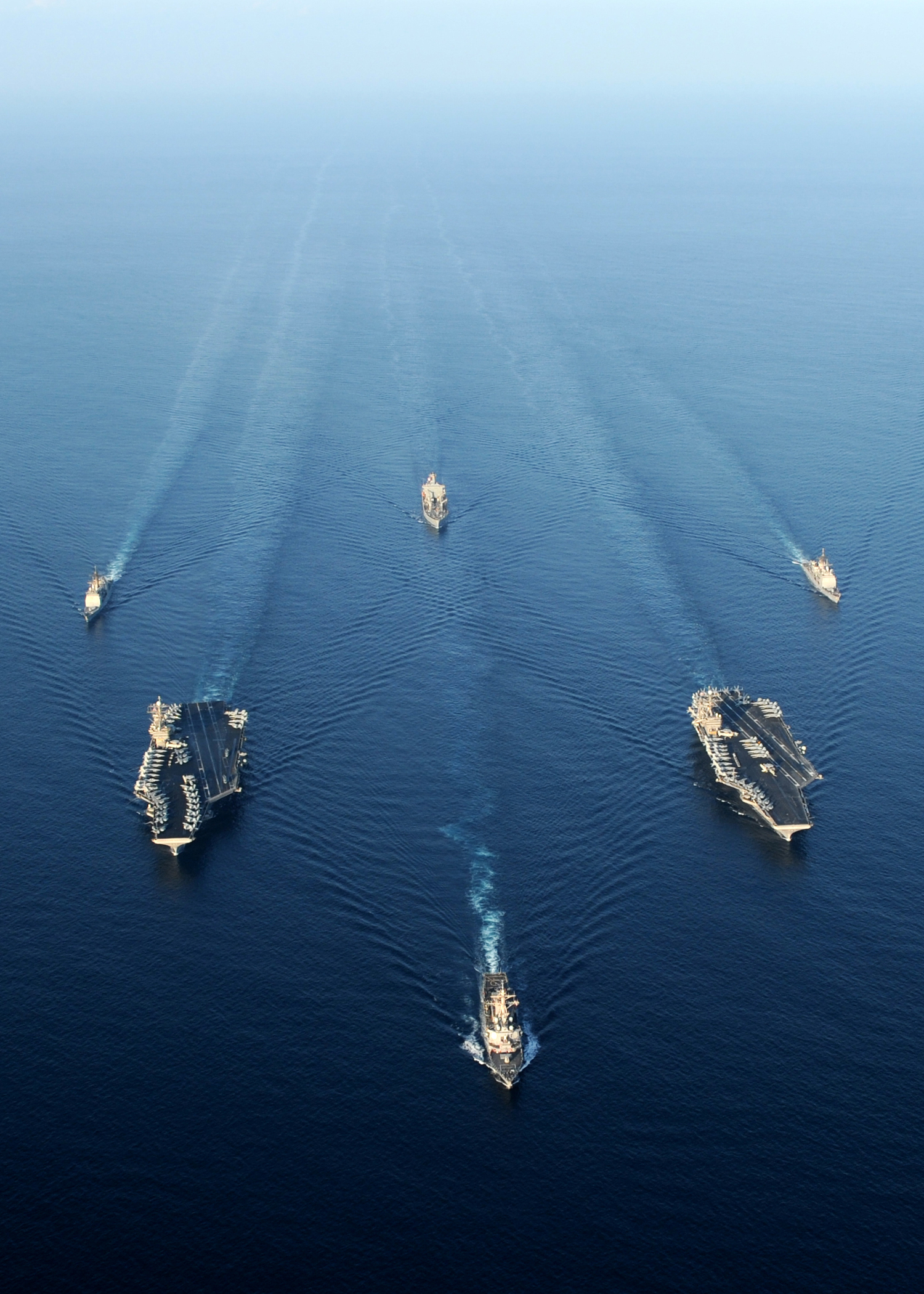US Navy 101123-N-4997L-601 Ships from the Abraham Lincoln Carrier Strike Group and the Harry S. Truman Carrier Strike Group cruise in a formation