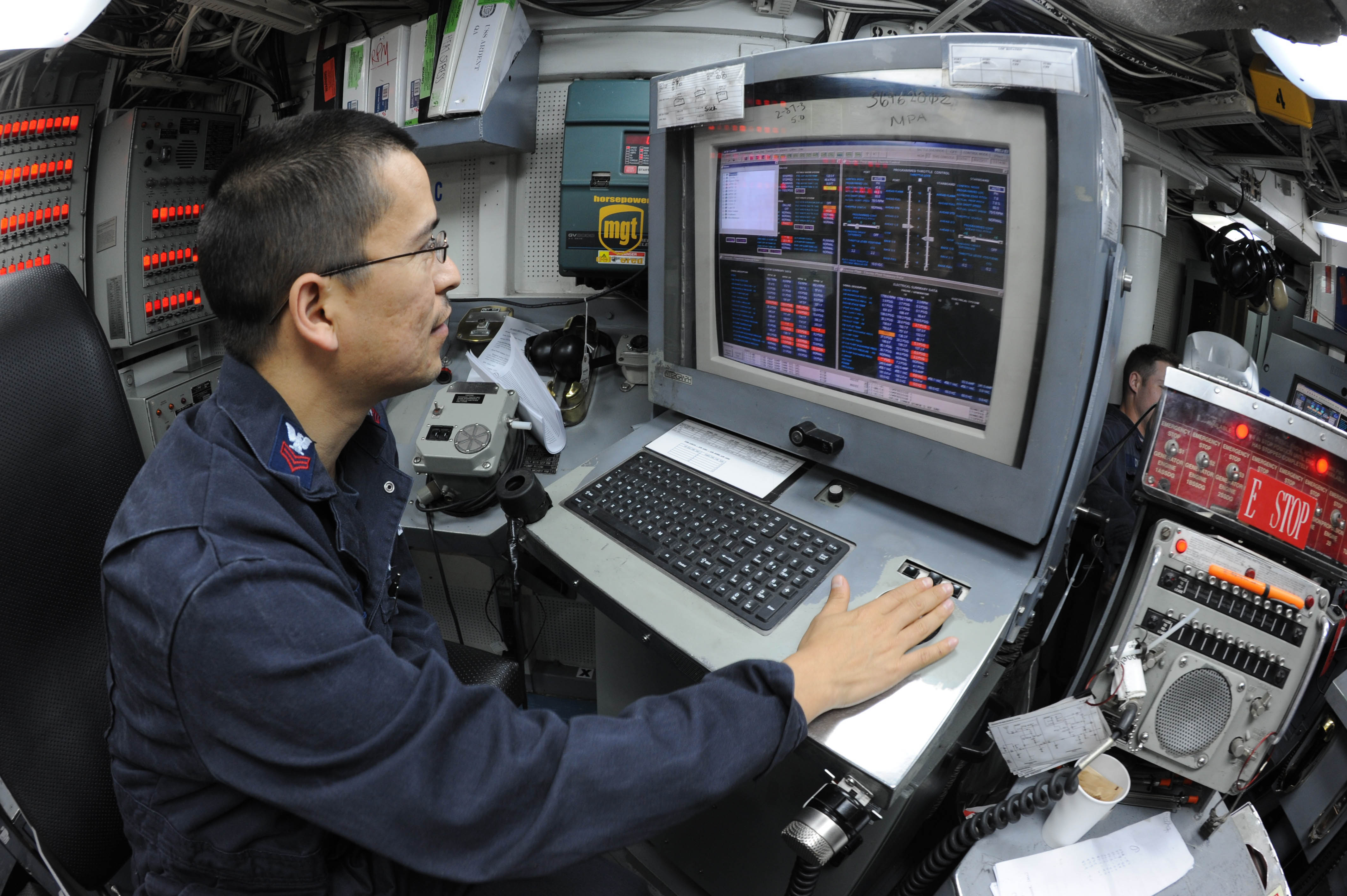US Navy 110323-N-8497H-110 Electrician's Mate 1st Class Jaime Garcia monitors the electronic propulsion plant console 