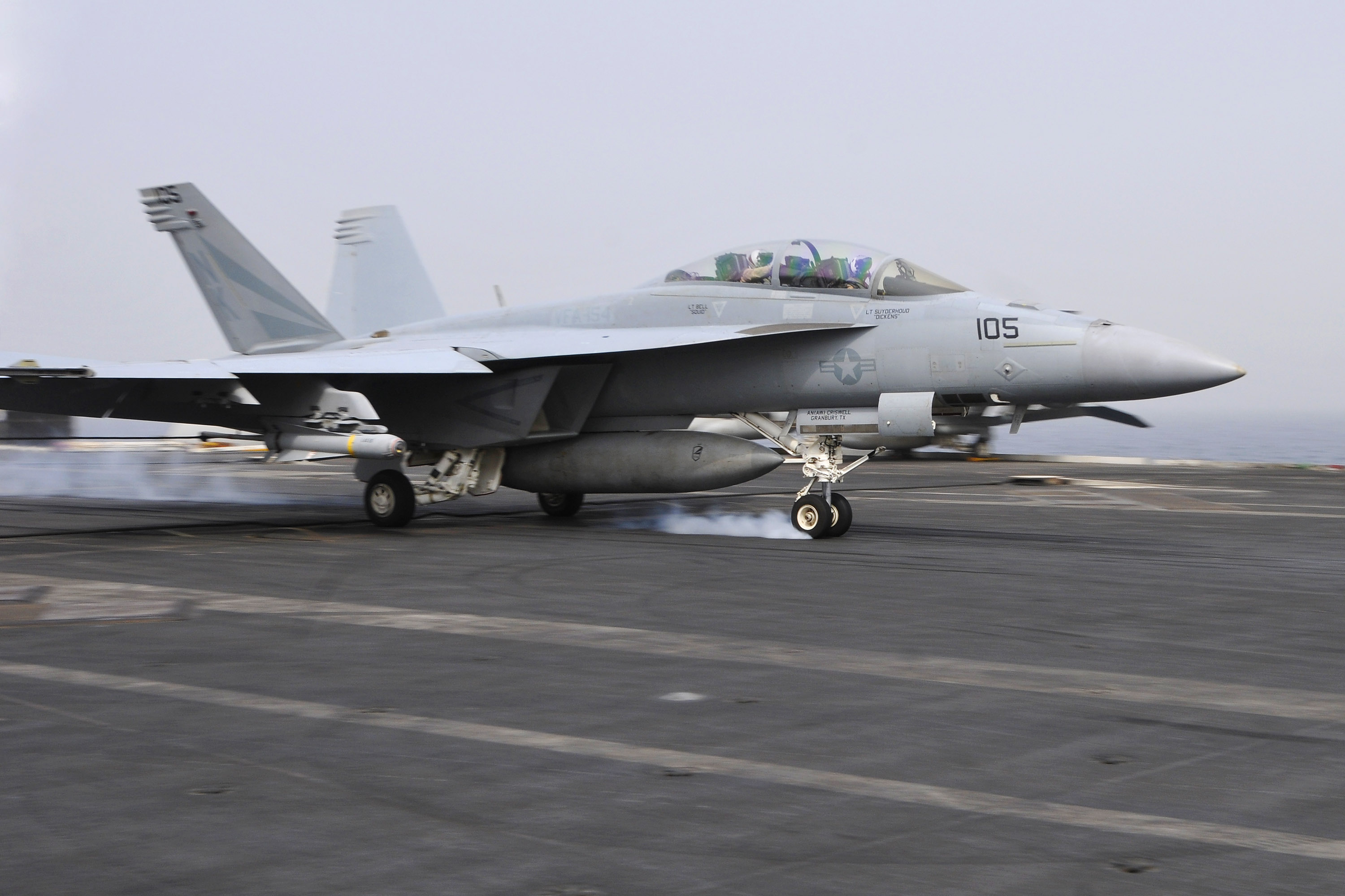 US Navy 110718-N-EE987-106 An F-A-18F Super Hornet assigned to the Black Knights of Strike Fighter Squadron (VFA) 154 lands aboard the aircraft car