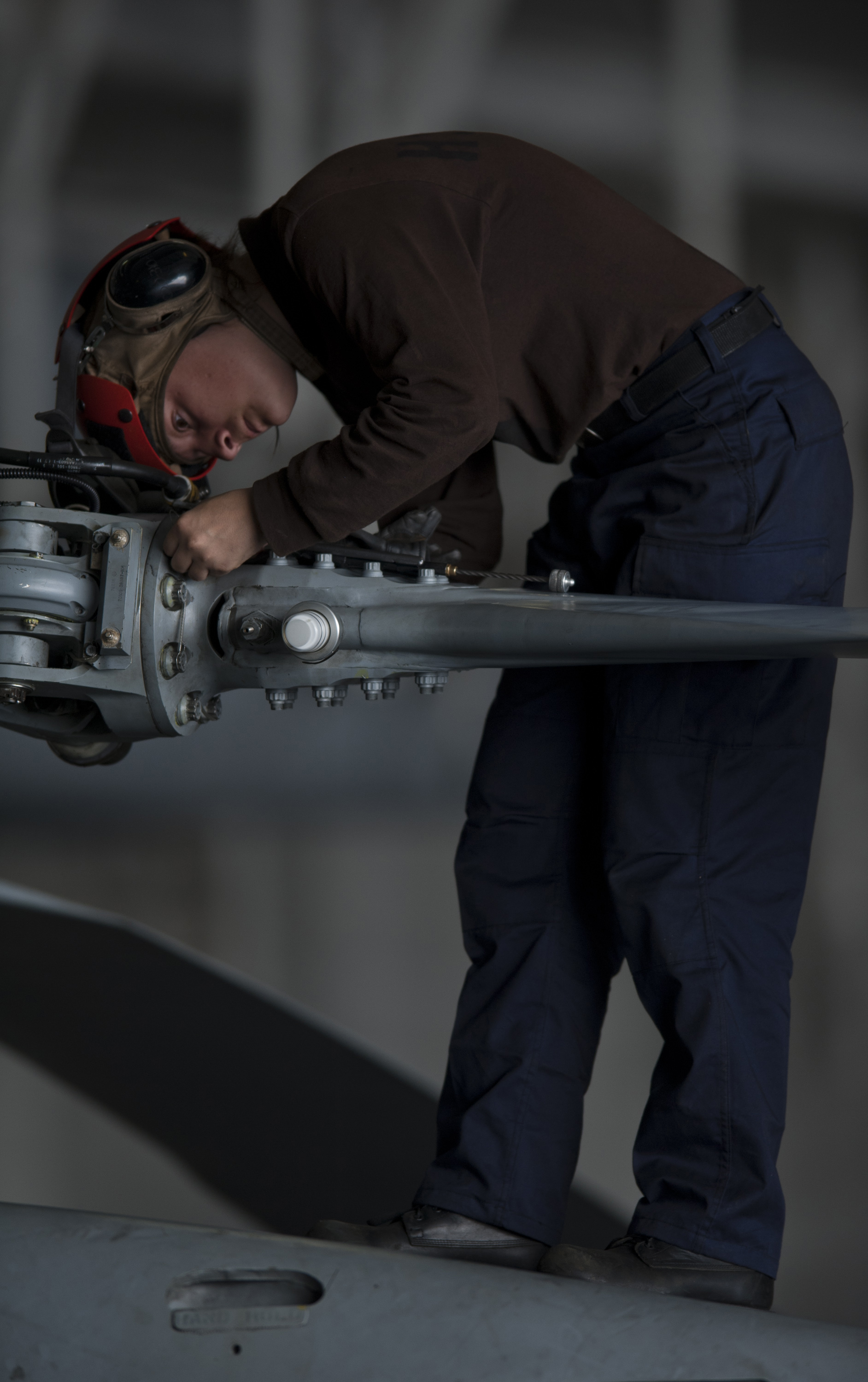 US Navy 111005-N-TU221-047 Airman Christyl Roper performs maintenance on the propellers of an MH-60R Sea Hawk helicopter