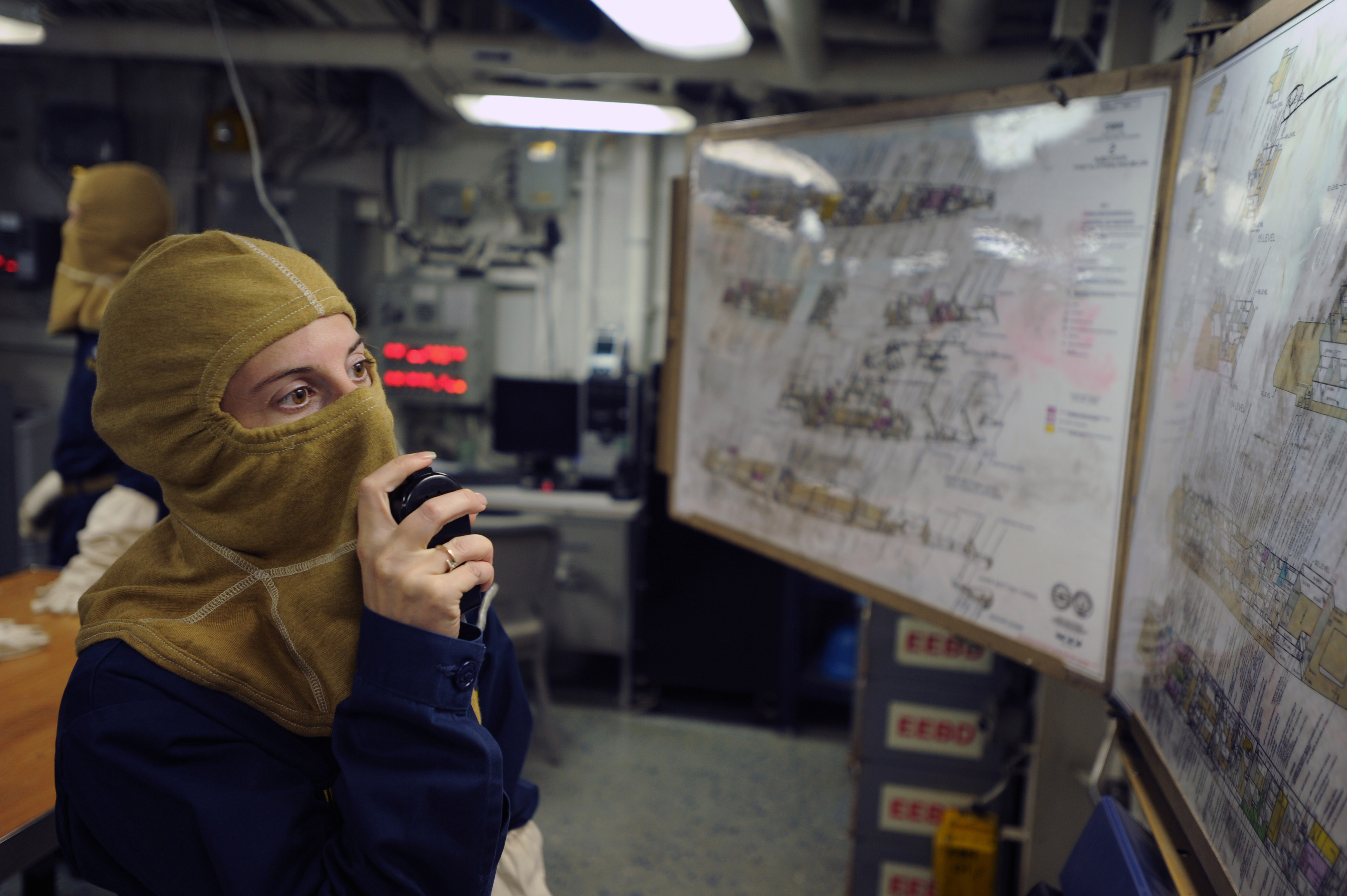 US Navy 111106-N-AX571-012 Lt. j.g. Karen Lingner speaks on the ship's one MC system during a general quarters drill