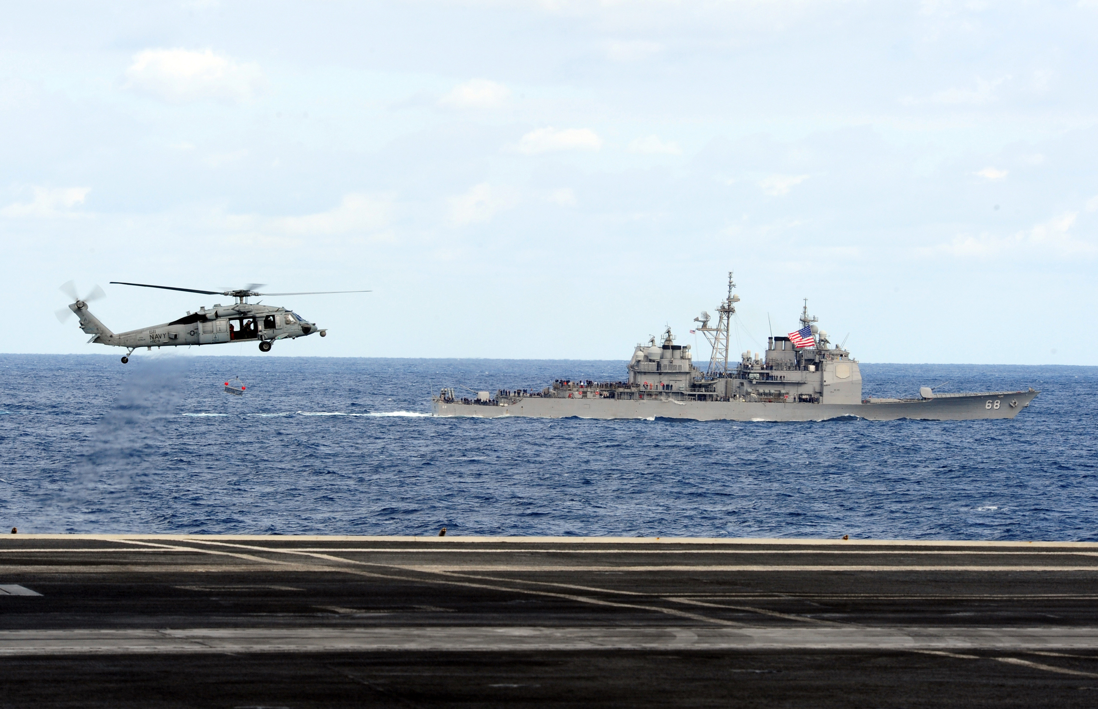 US Navy 111209-N-QL471-353 Helicopter performs a fly-by