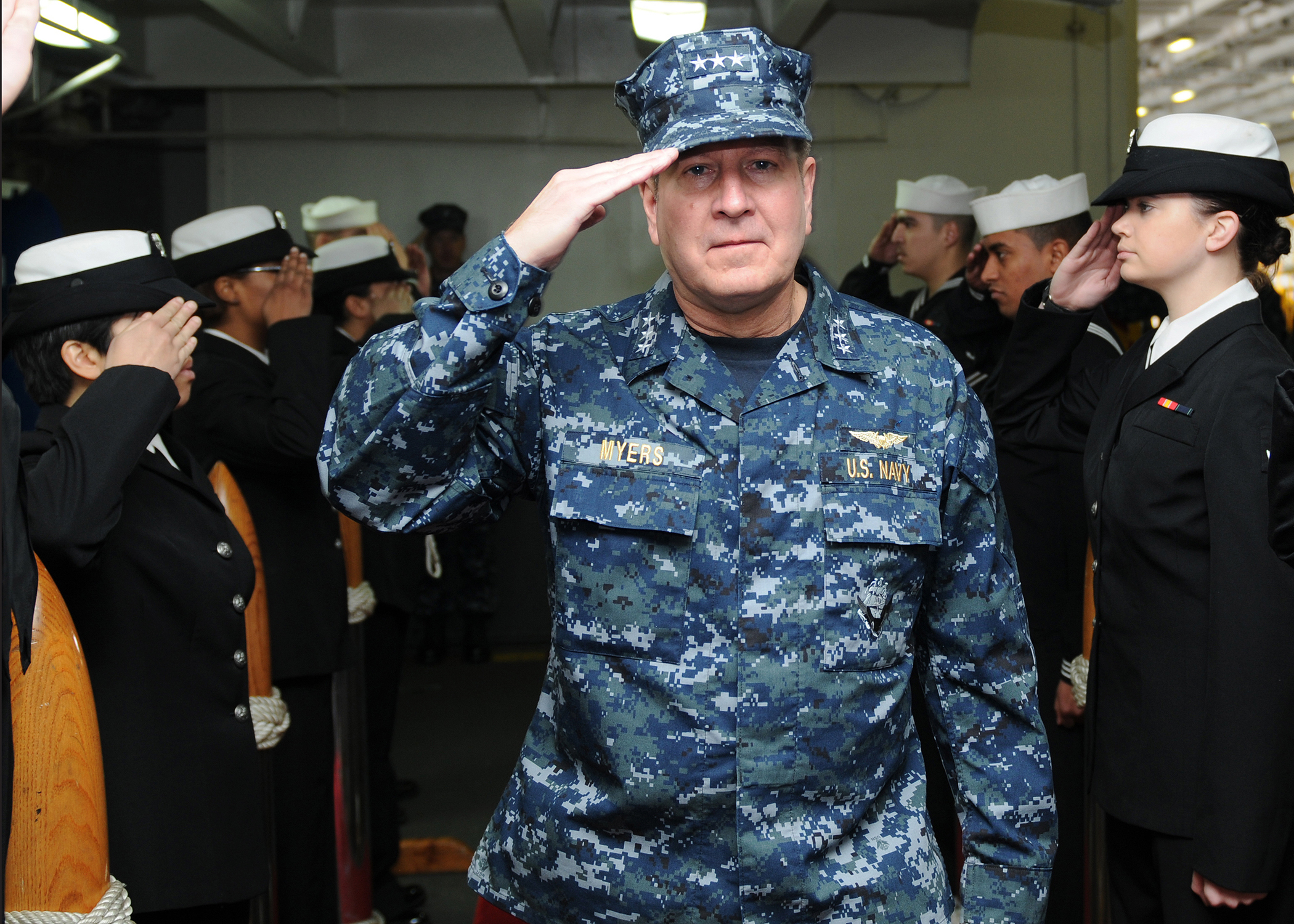 US Navy 111211-N-KQ416-005 Vice Adm. Allen G. Meyers, commander of Naval Air Forces (CNAF), passes through sideboys aboard the Nimitz-class aircraf