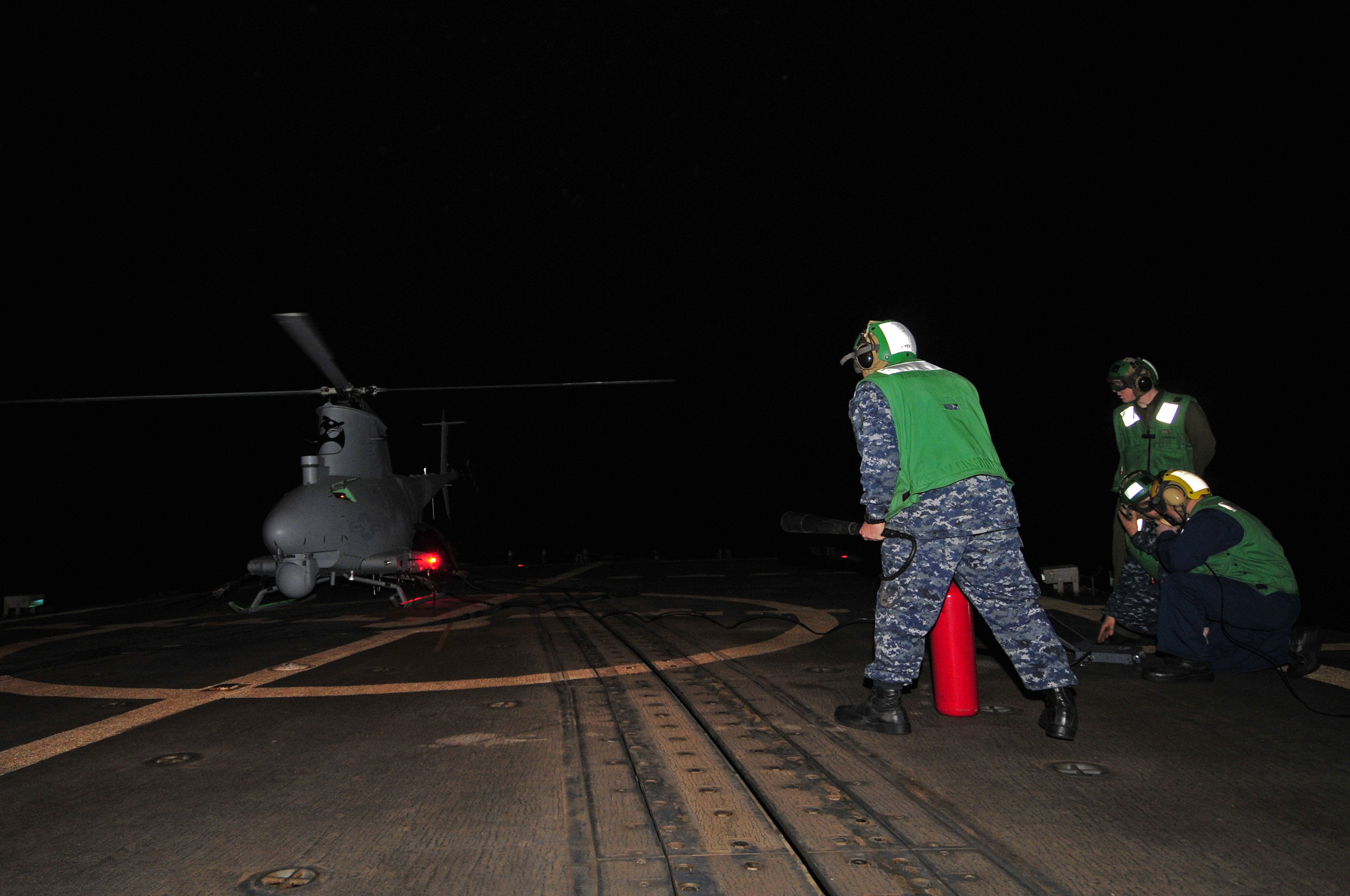 US Navy 120208-N-IZ292-062 Sailors prepare to launch an MQ-8B Fire Scout unmanned aerial vehicle (UAV) during nighttime flight operations aboard th
