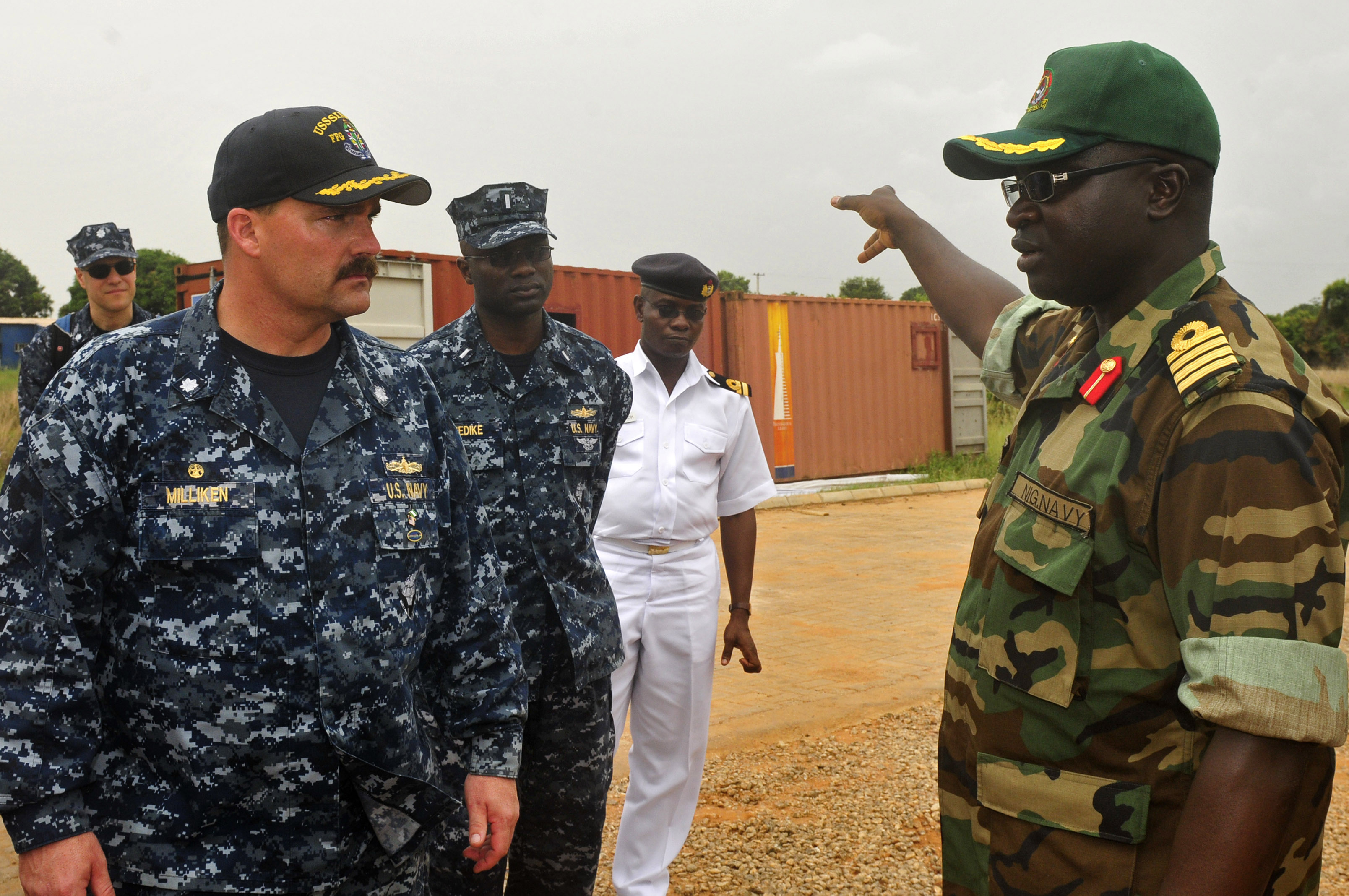 US Navy 120215-N-IZ292-243 Cmdr. Leonard Milliken, commanding officer of the guided-missile frigate USS Simpson (FFG 56), is briefed by Nigerian na