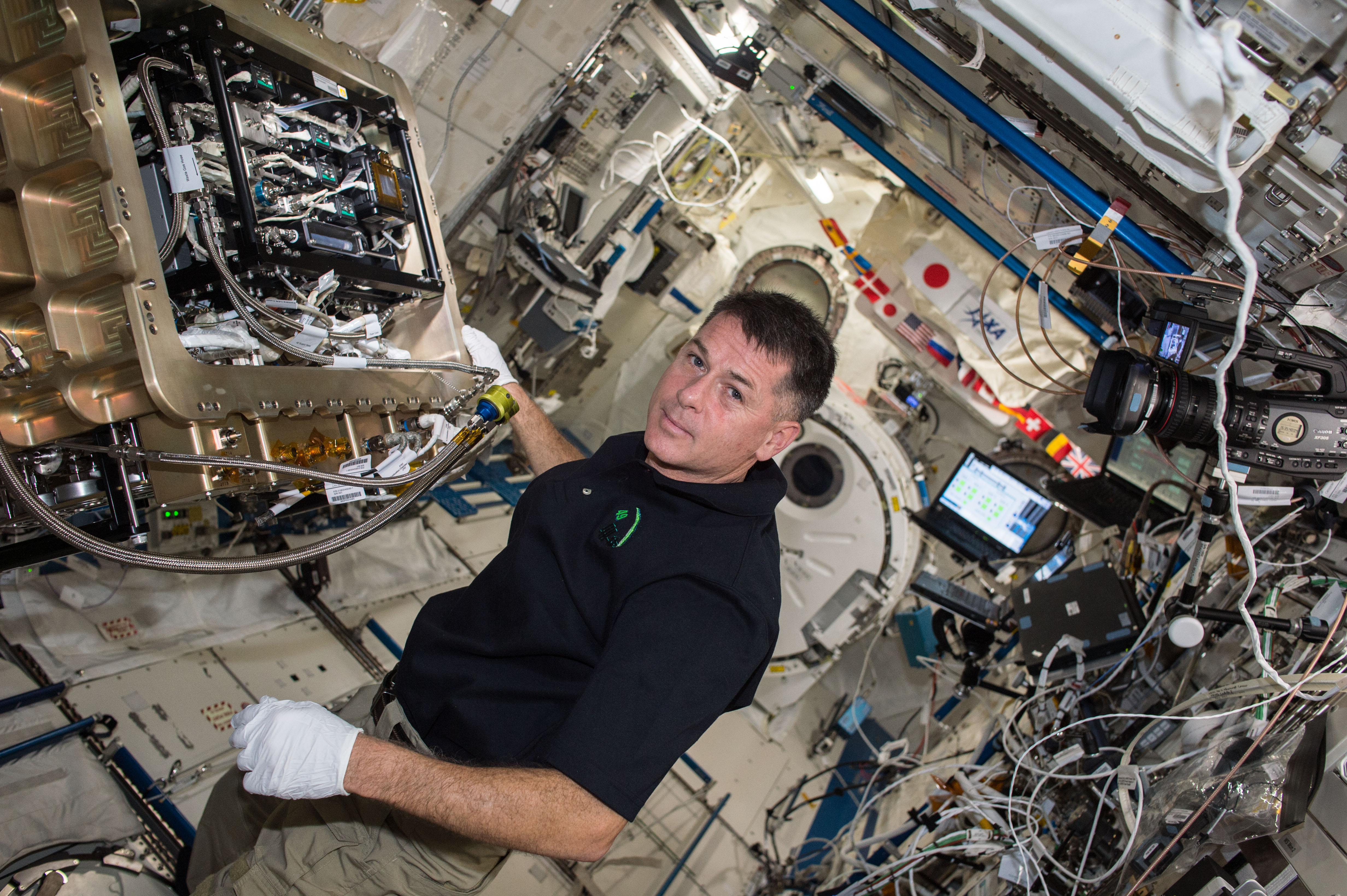 ISS-50 Shane Kimbrough with the Group Combustion Module in the Kibo lab