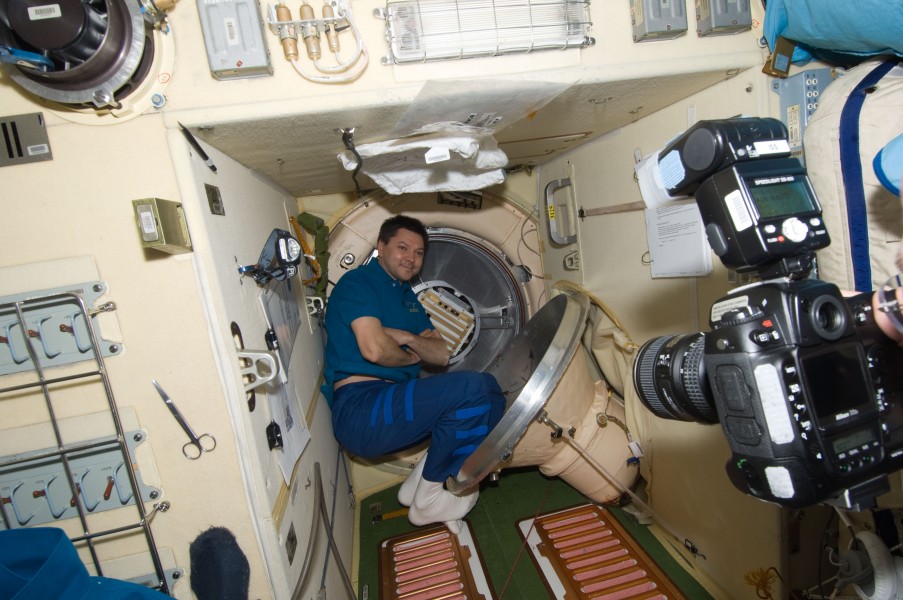 ISS-30 Oleg Kononenko in the Pirs Module with Progress M-13M and the Chibis-M satellite