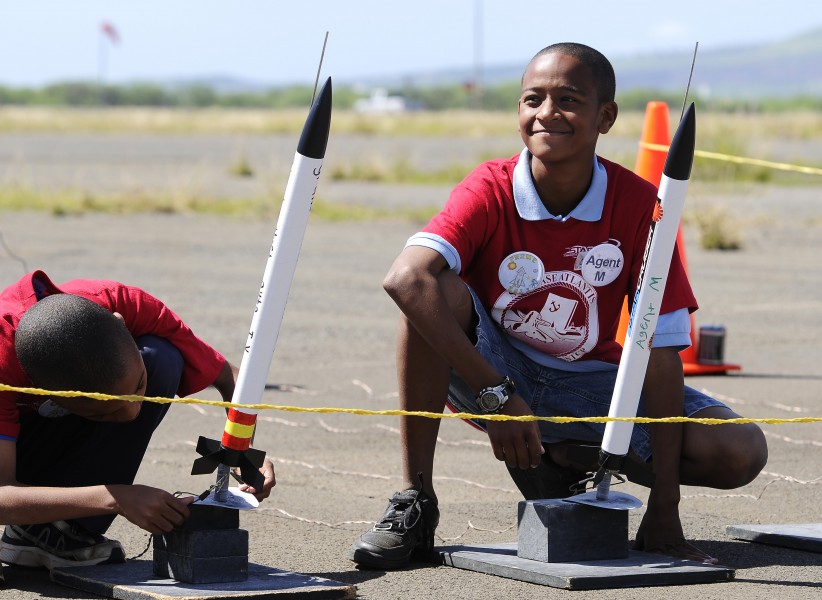US Navy 110208-N-WP746-093 Students from Pearl Harbor Kai Elementary School prepare to launch homemade rockets at Ford Island as part of their grad