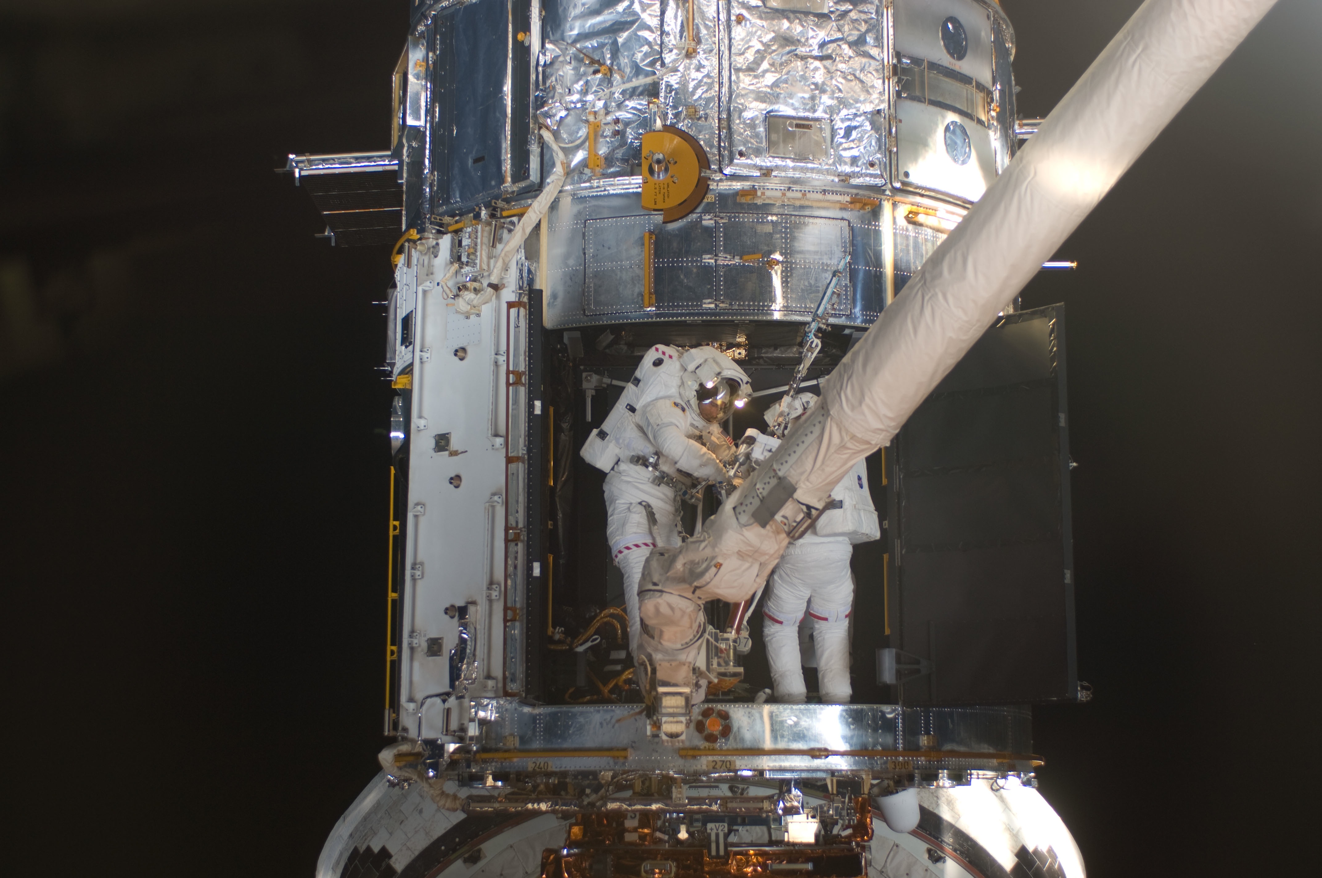 STS-125 EVA4 Working inside Hubble