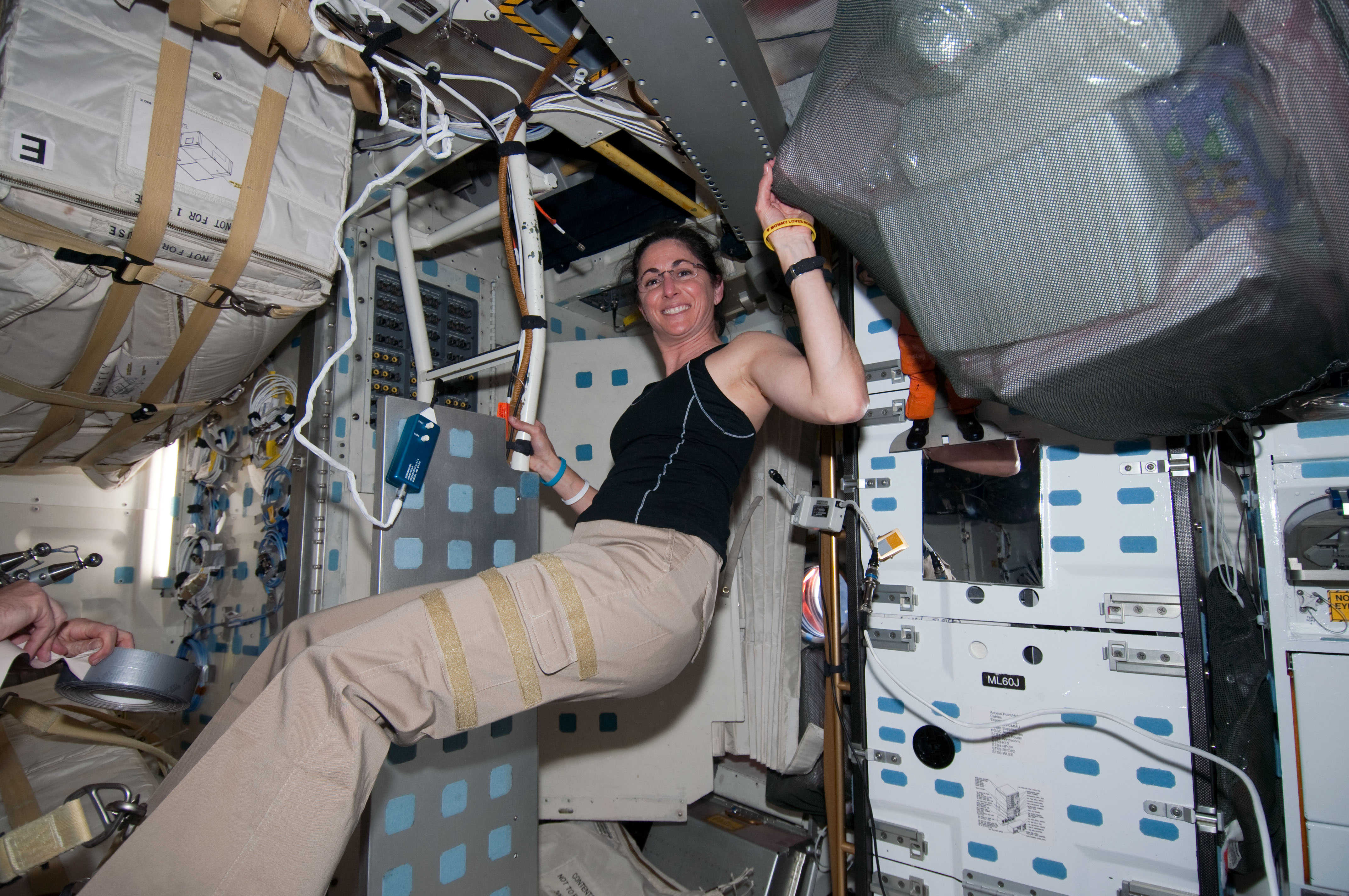 STS-133 Nicole Stott on the middeck